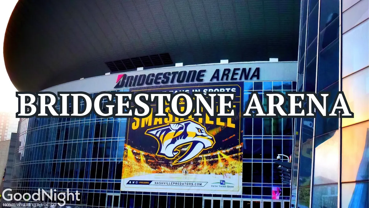 A dynamic exterior shot of Bridgestone Arena, home to the Nashville Predators, with banners and modern architectural details. The excitement of a major city venue is palpable, with the promise of sports events, concerts, and bustling city life just steps away.